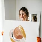 Happy woman carrying abstract picture